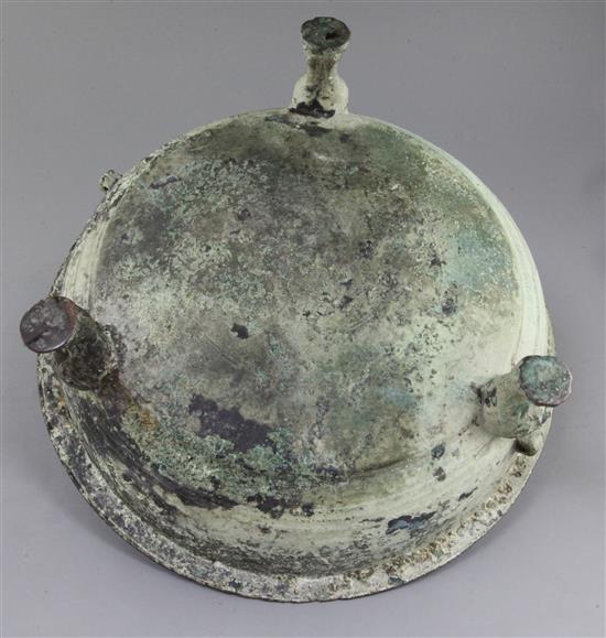 A Chinese archaic bronze tripod water basin, Pan, Warring States period, 4th/2nd century B.C., 39cm diameter, holes beneath rim